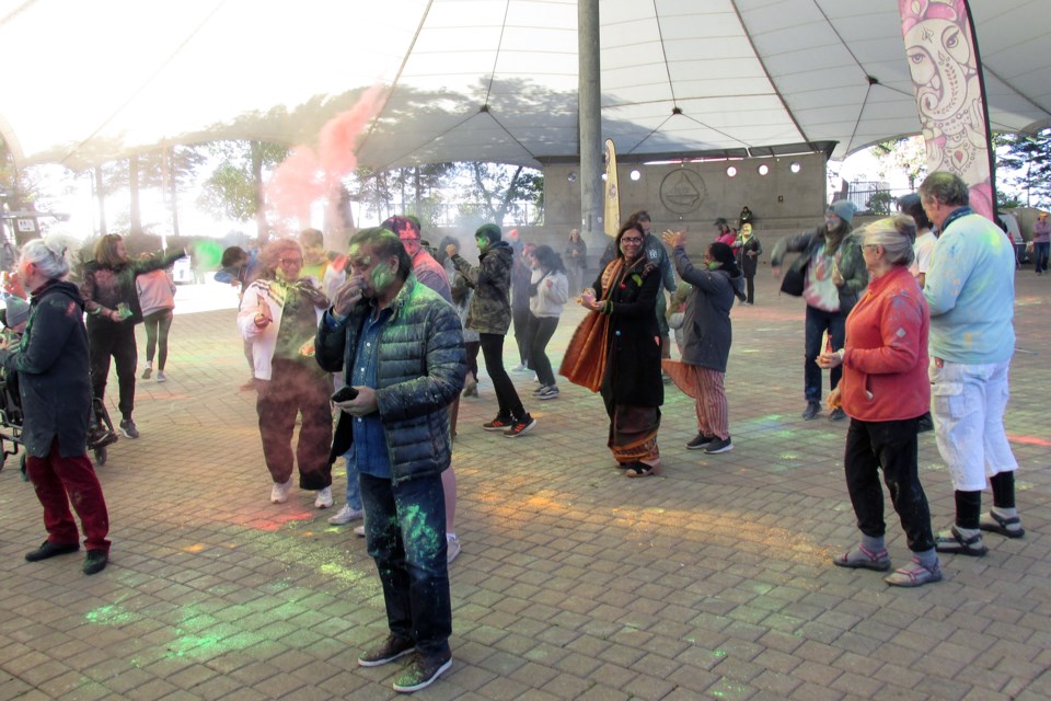 Coloured powder is thrown during the Festival of Colours, held Sunday at the Roberta Bondar Pavilion. The event has been held for years in Thunder Bay but this is the first time it has been held in the Sault.