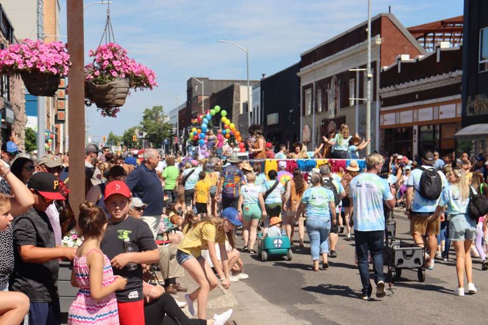 Thousands lined the streets of downtown on Saturday as floats, bands, and dancers took part in the 99th Rotary Community Day Parade.