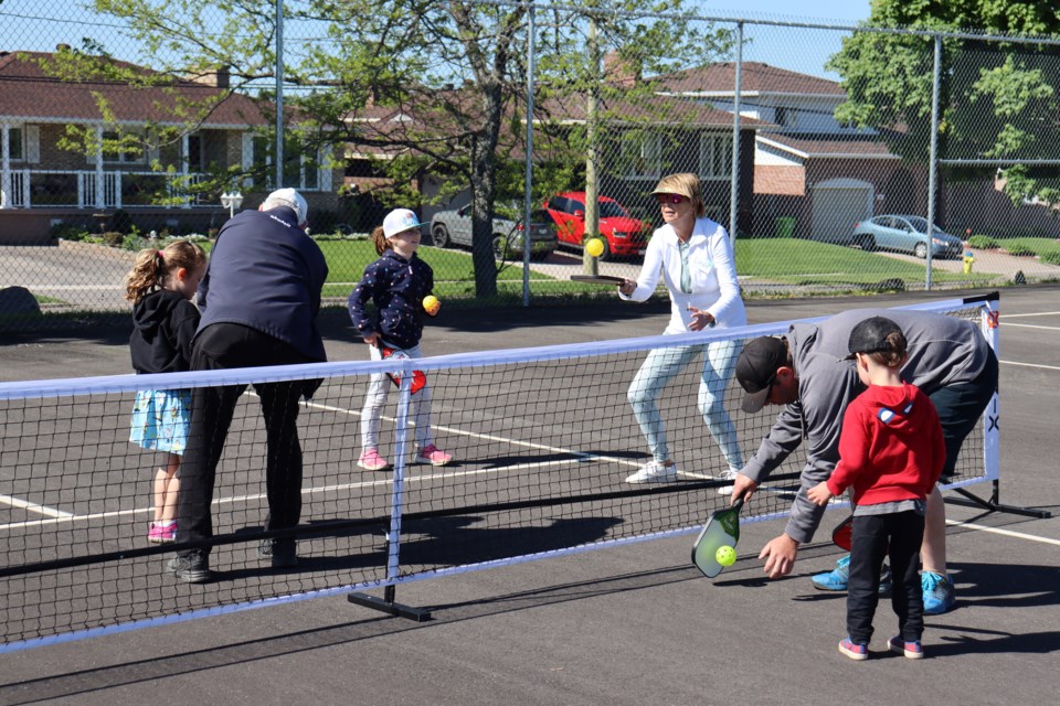 Locals play pickleball on Try a Sport Day. 