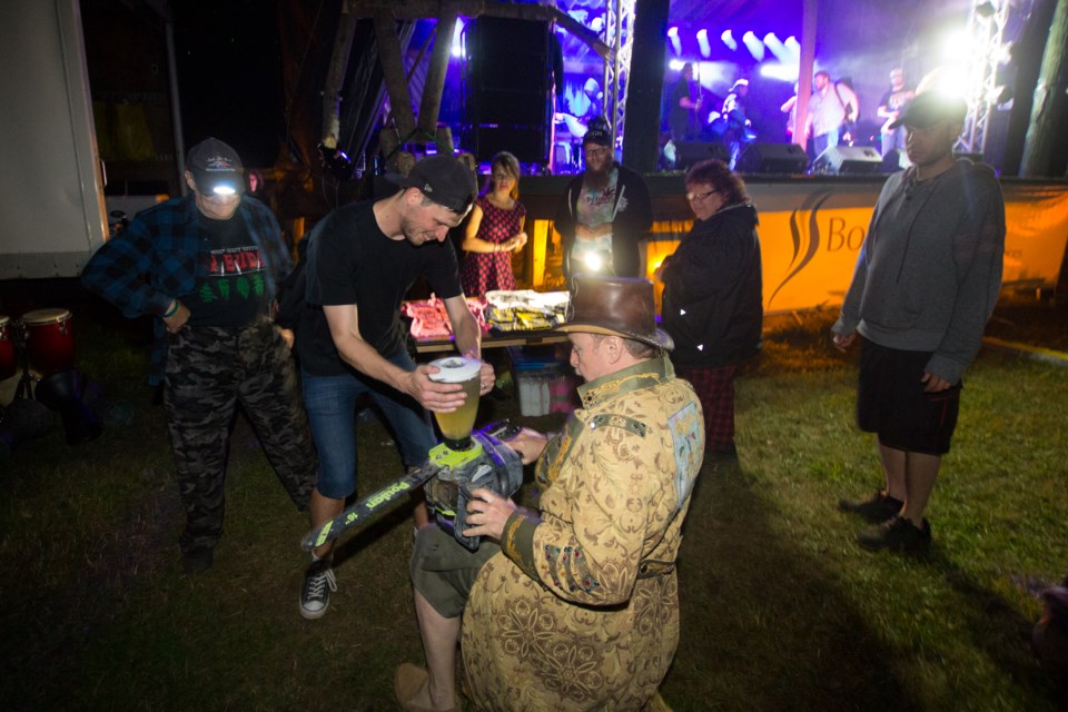 Dr. Cuervo making chainsaw margaritas for The Northern Vibe Festival's headlining act My Son the Hurricane. Jeff Klassen/SooToday