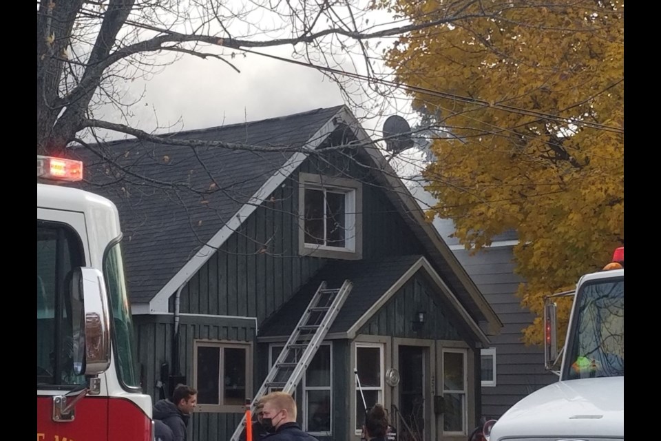 Smoke can be seen billowing from a house on Parliament Street near Bloor Street