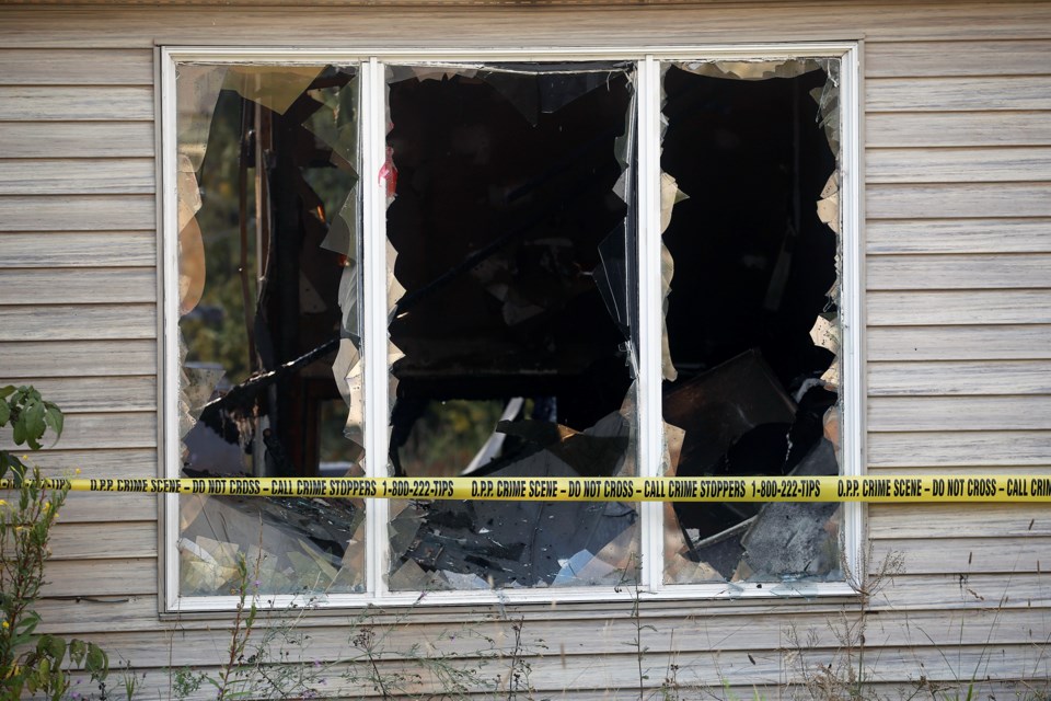 OPP tape surrounds the scene of a trailer fire Monday on Rupert Acres Drive in Heyden.