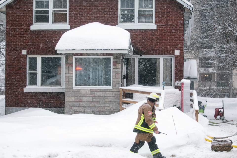 Firefighters respond to a call in the 200-block of Wellington Street E. on Monday morning.