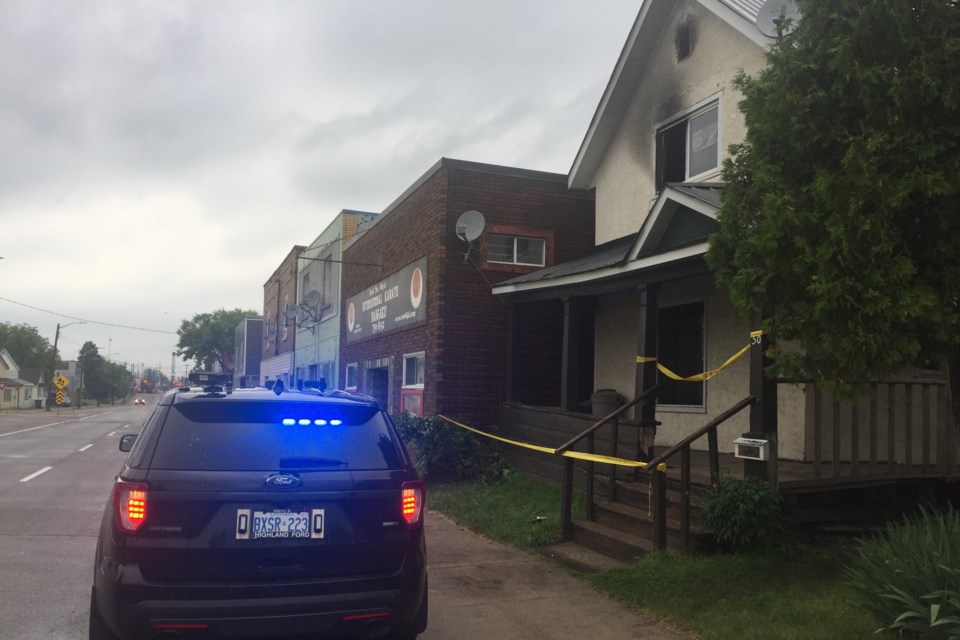 Police remain on the scene of a residential fire that displaced four people from 50 Wellington West early Sunday morning. David Helwig/SooToday