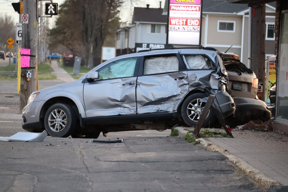 SUV ends up smashing into BST Pawnbroker building following two-vehicle collision in the city's west end. 