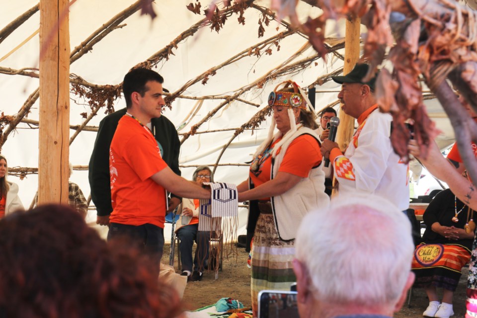 Garden River First Nation Chief Karen Bell presents Sault Ste. Marie Mayor Matthew Shoemaker with a wampum belt during a special ceremony held outside of the Garden River Community Centre Monday.  