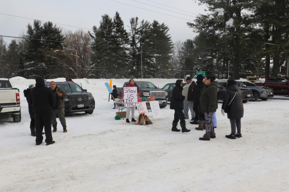 More than a dozen protesters gathered outside the band office in Garden River First Nation Wednesday to voice their discontent with how leadership handled the distribution of more than $610 million in Robinson Huron Treaty settlement proceeds