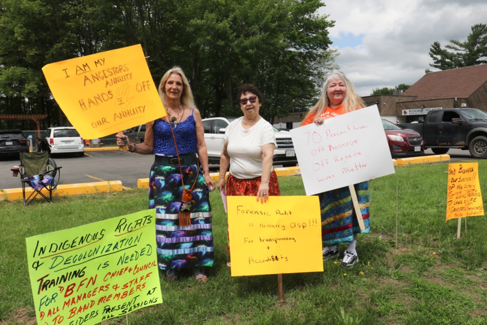 A group calling itself the clan grandmothers staged a rally outside of the Batchewana First Nation band office Tuesday over the First Nation's plans to distribute the Robinson Huron Treaty settlement amongst its membership. Left to right: Patti McIntomney, Adele Madigan and Mona Bell. 