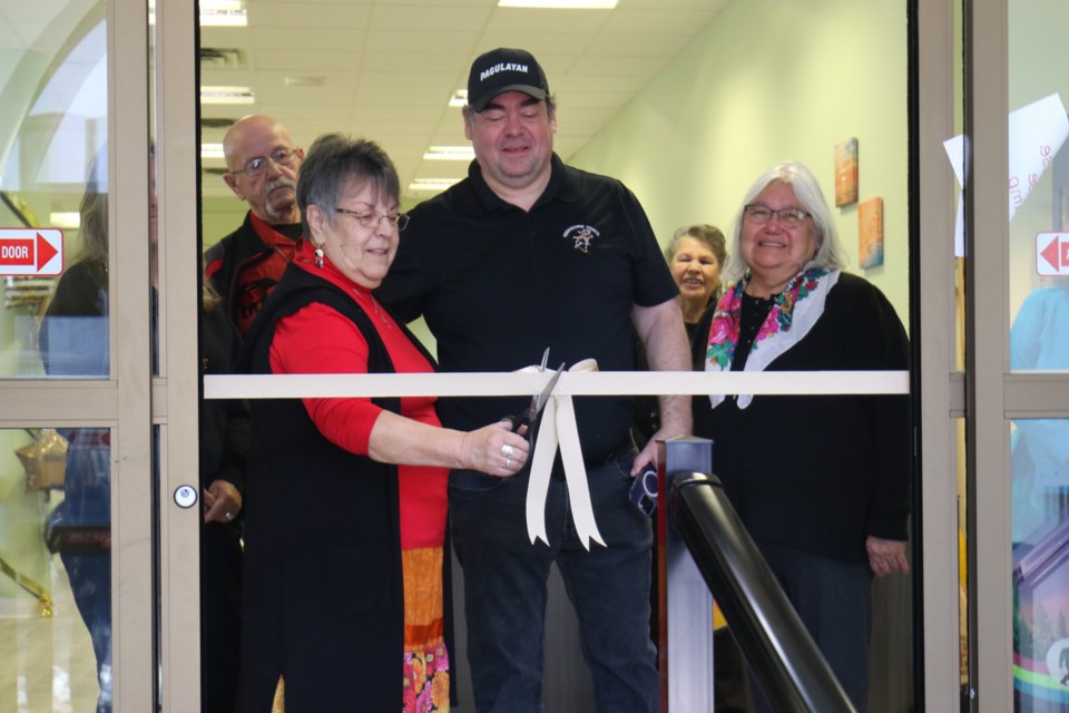 June Markie, the longest-tenured employee at Missanabie Cree First Nation, had the honours of cutting the ribbon to the community's new band office Wednesday as Missanabie Cree First Nation Chief Jason Gauthier looked on. The new offices are located in the former Royal Bank of Canada building in downtown Sault Ste. Marie. 