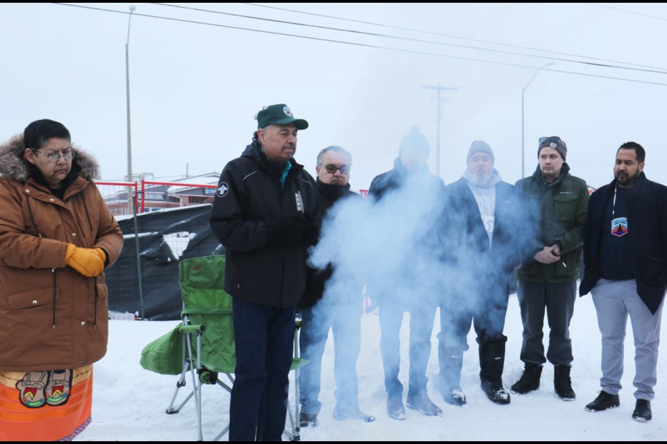 Darrell Boissoneau, cultural services manager & special events for Sahkahjewaosa: Bigii Weh Wok – They are Coming Home, (second from left) speaks during a sunrise ceremony held at the former site of Wawanosh Home for Girls Tuesday morning. 