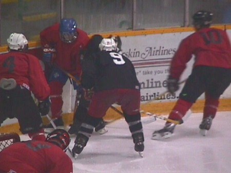 <b>Thessalon native Jacob King (#9) waits as players battle along the boards in scrimmage on Thursday afternoon.