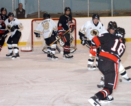 <b>Thunderbirds forward Paul DuPont (#11) provides a screen for Joey Thorburn's (#16) shot.