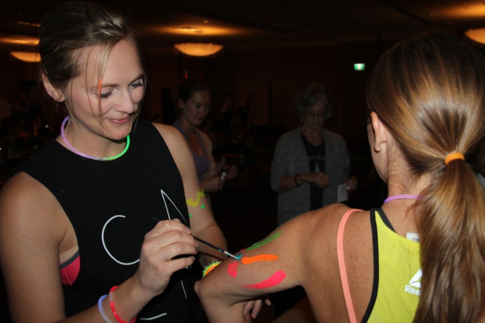 A group of Sault yoga practitioners brushed themselves in glow paint, mingled and took part in a Glow and Flow yoga class at the Delta Hotel, arranged by Fit Bodies Fit Minds, Oct. 5, 2017. A portion of the proceeds went to the Healthy Kids Community Challenge Takeout Days. Darren Taylor/SooToday 