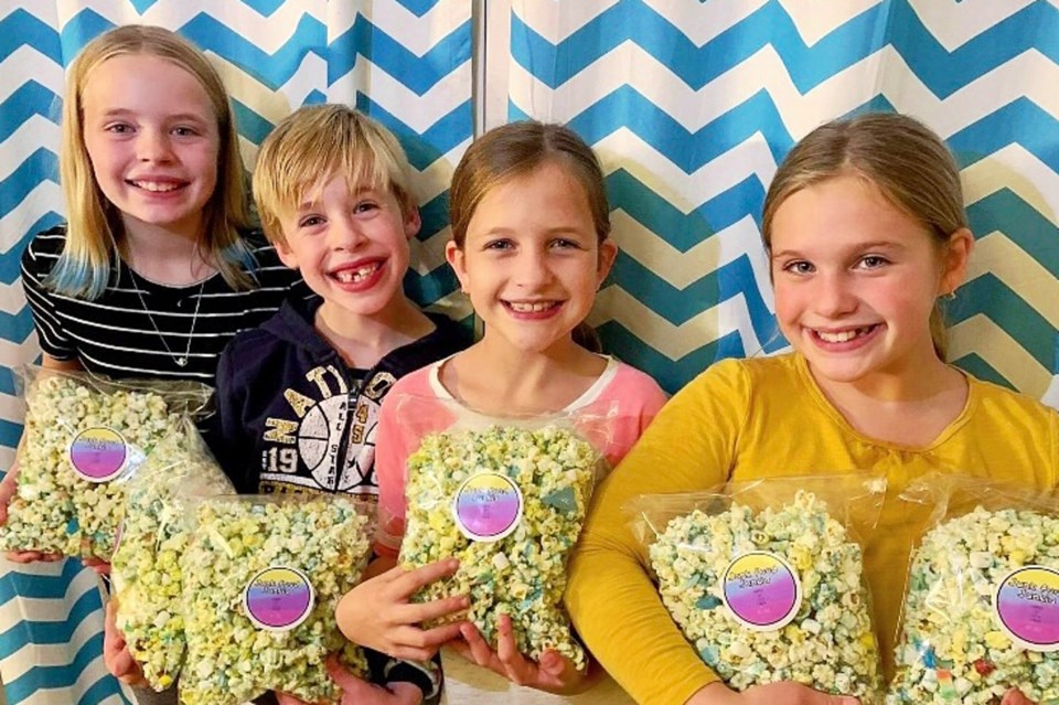 Kids Holding Popcorn Bags