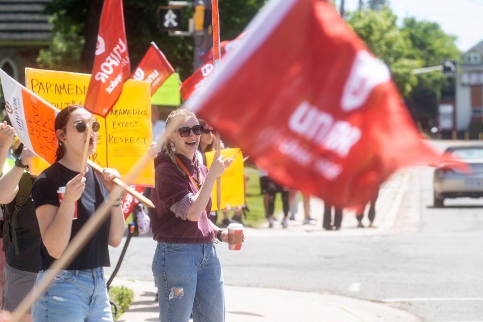 Paramedics from UNIFOR Local 1359 and their supporters rallied outside of the Social Services building on Albert Street East on Tuesday to raise awareness about the ongoing contract negotiations.