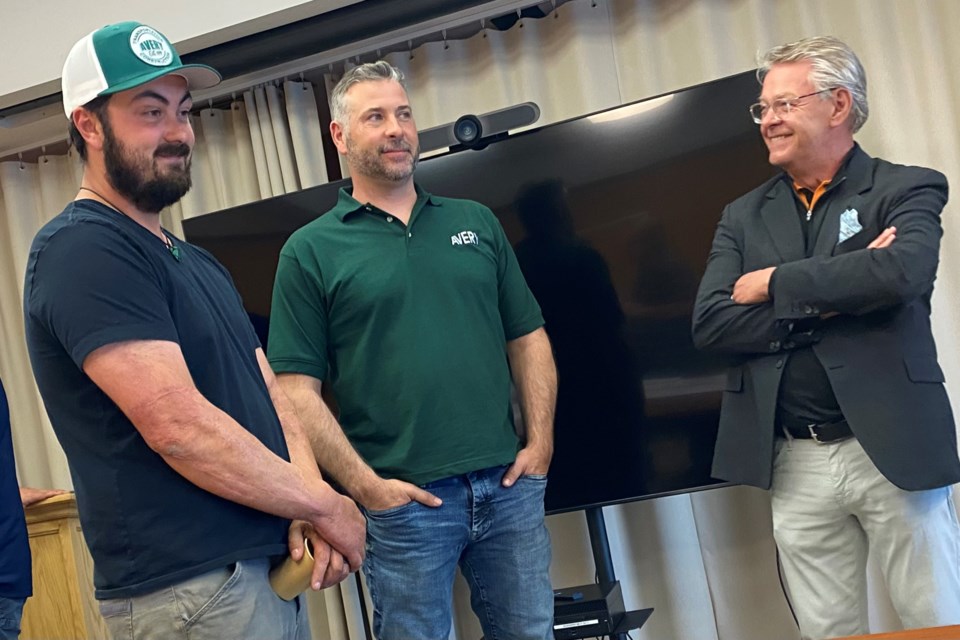 Josh Maahs and Brent Avery from Avery Construction talk to Geoff Bishop from His Hers Home at a Thursday-night briefing about the soon-to-commence Queen St. reconstruction