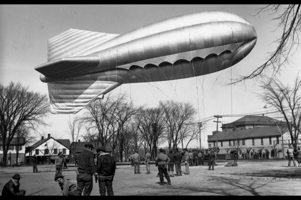 US military personnel launch a barrage balloon over the Michigan Soo Locks in 1942.