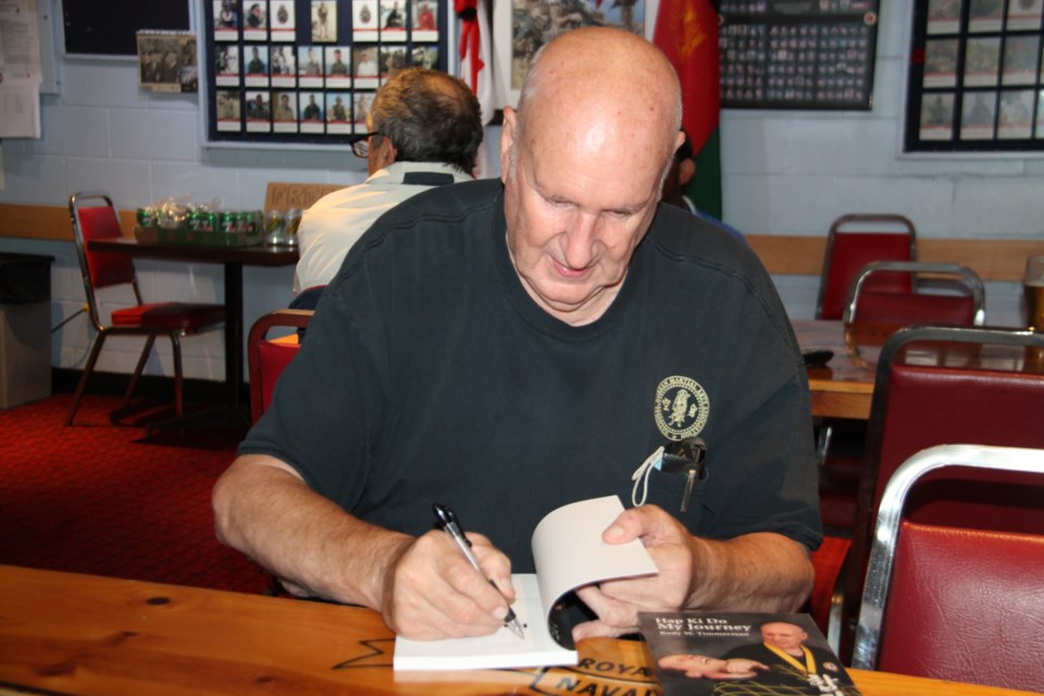 Rudy Timmerman, Grandmaster of the Legion Hap Ki Do Club, signs a copy of his book entitled Hap Ki Do - My Journey, August 27, 2021. Darren Taylor/SooToday