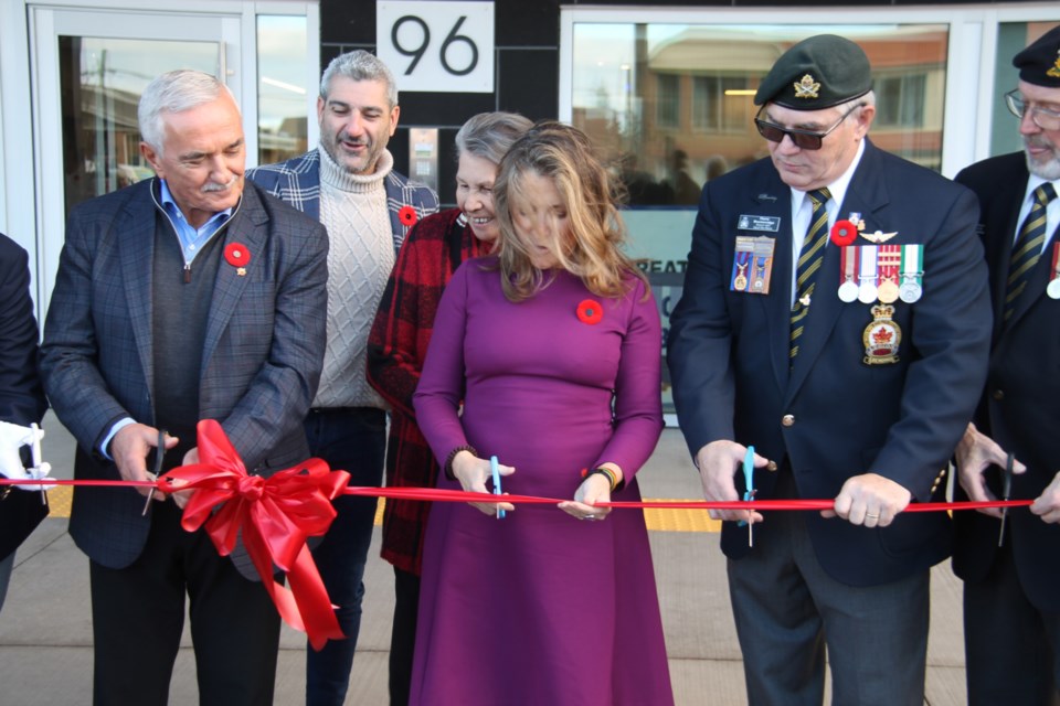 Deputy Prime Minister Chrystia Freeland, joined by SalDan Developments President Sam Biasucci, Sault MPP Ross Romano, the Children of Shingwauk’s Shirley Horn and Royal Canadian Legion Branch 25 President Pierre Breckenridge, cut the ribbon at the official opening ceremony of Branch 25’s new office and apartment building at 96 Great Northern Rd., Nov. 1, 2024