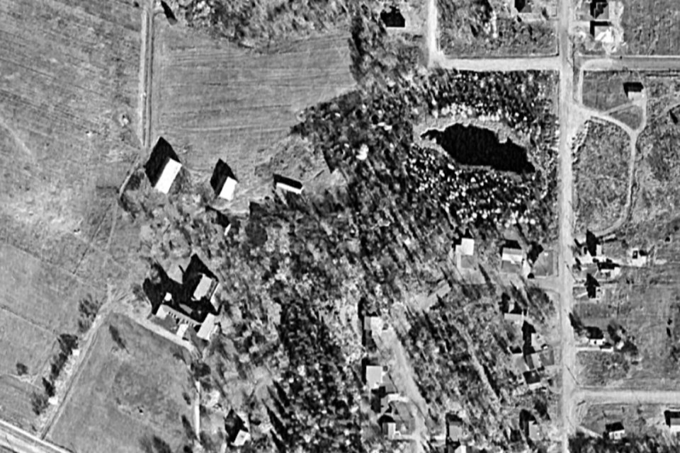 This Government of Canada aerial photograph, taken in 1957, shows a 'little lake' near the Shingwauk Indian Residential School where two boys drowned in 1914-15 in what's now known as Snowdon Park. Their bodies were never recovered. The pond was filled in and became a city park. The boys were never identified and their bodies are believed to be somewhere on the site