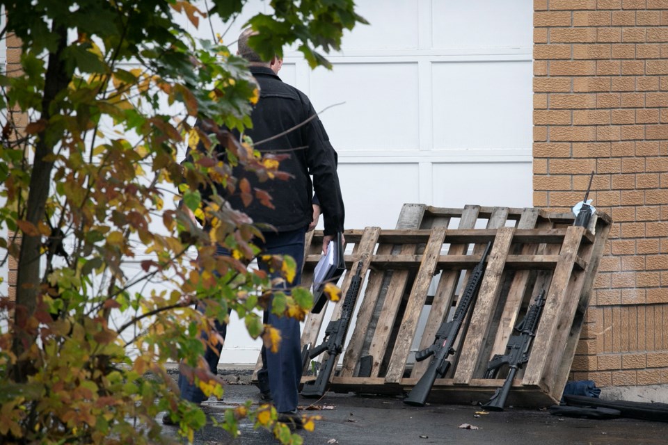 Three possible long guns shown at the scene of a police call Thursday afternoon on Old Garden River Road. 