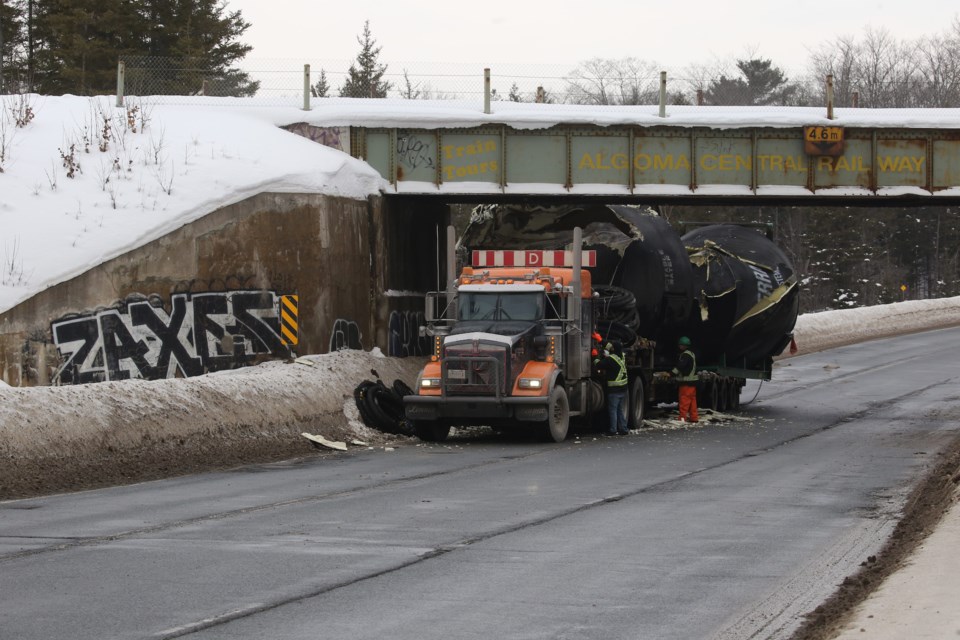 Great Northern closed after transport hits rail overpass 6 photos