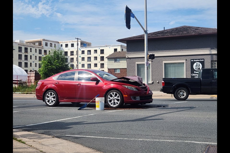 Emergency crews respond to a crash at Queen and Church streets on Monday, July 15, 2024