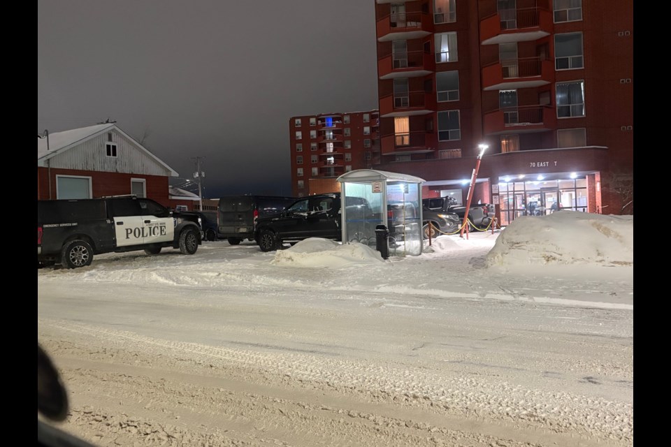 A large group of police officers entered 70 East St. on Sunday night