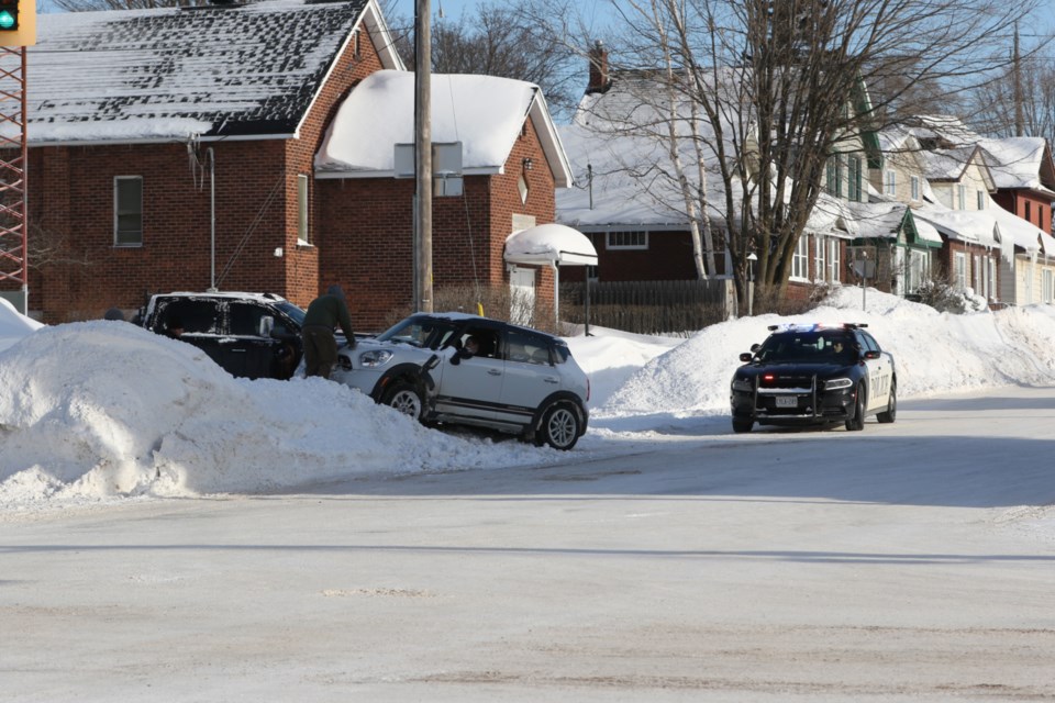 A couple Good Samaritans helped free a vehicle from a snowbank on Bruce St. Friday morning.  