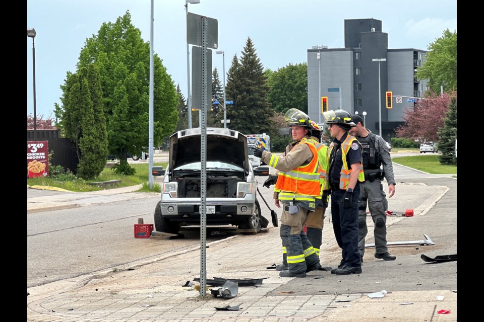 The scene of a two-vehicle collision at Andrew Street and Queen Street West on Monday, May 27, 2024