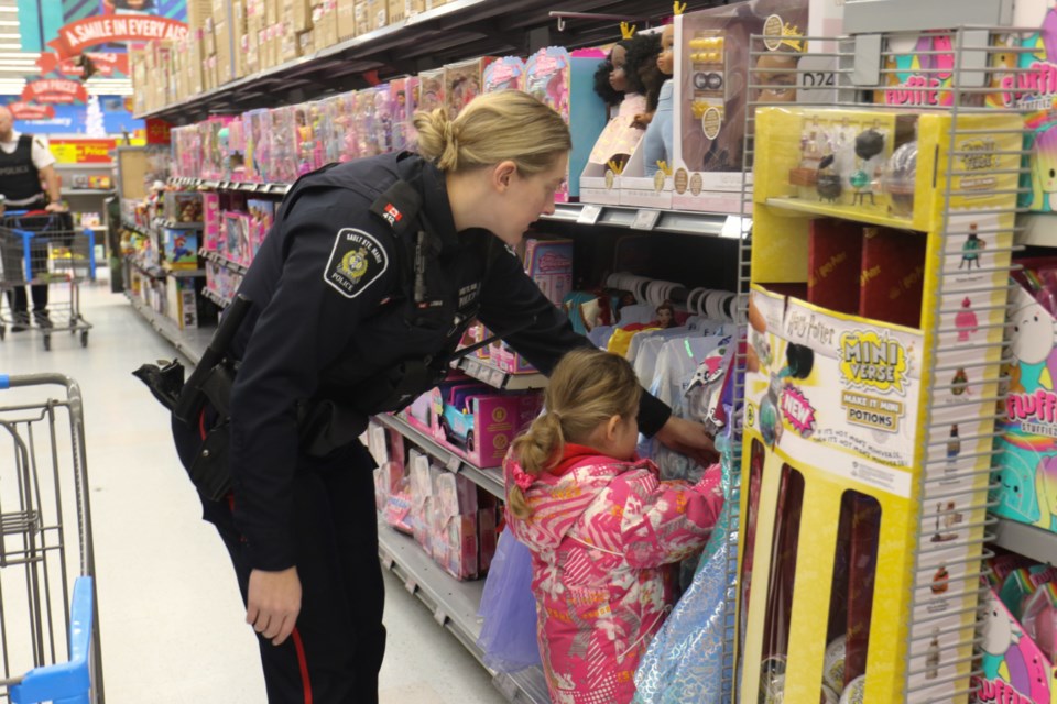 The Sault Ste. Marie Police Association partnered with local law enforcement agencies to take more than a dozen kids on a holiday shopping spree at Walmart Saturday morning.