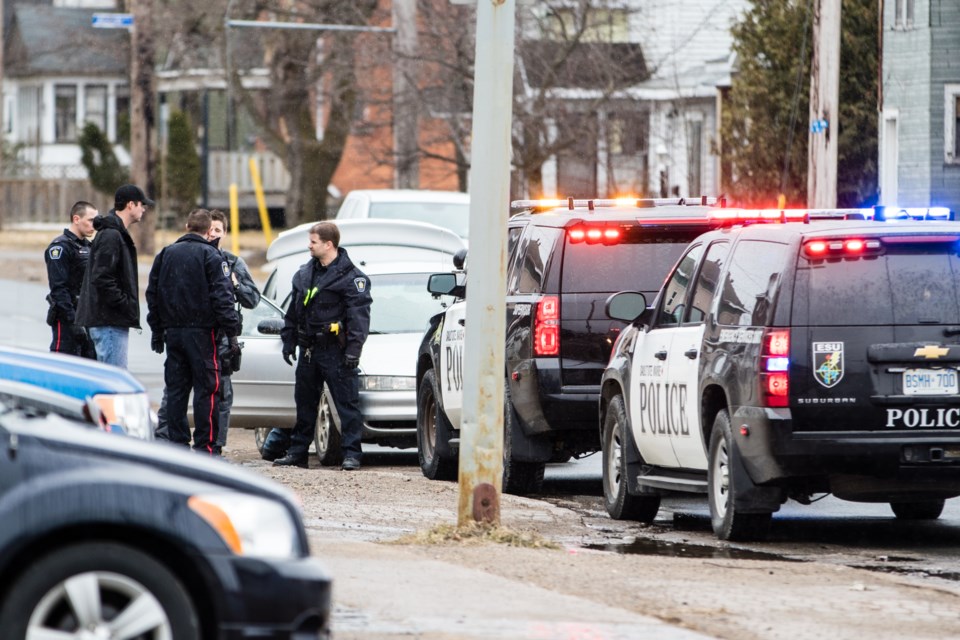 Police are pictured on Wellington Street near Gore Street on Monday, April 3, 2017. Donna Hopper/SooToday