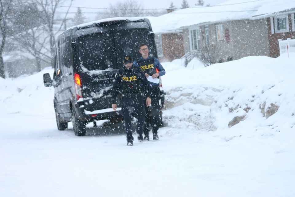 The officers attended the home in unmarked vehicles at 7:18 a.m.