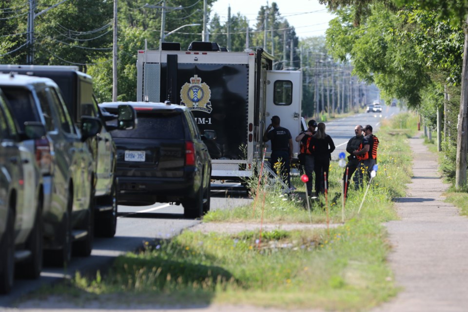 Members of Sault Ste. Marie Police Service and the Ontario Provincial Police search a property in the 1400 block of Peoples Road Aug. 7. The significant police presence was connected to the investigation into missing 40-year-old Jake Corbiere, who has not been seen since March 12, 2023. 