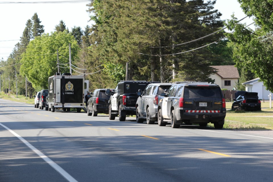 Members of Sault Ste. Marie Police Service and the Ontario Provincial Police search a property in the 1400 block of Peoples Road Wednesday morning. The significant police presence is connected to the investigation into missing 40-year-old Jake Corbiere, who has not been seen since March 12, 2023. 