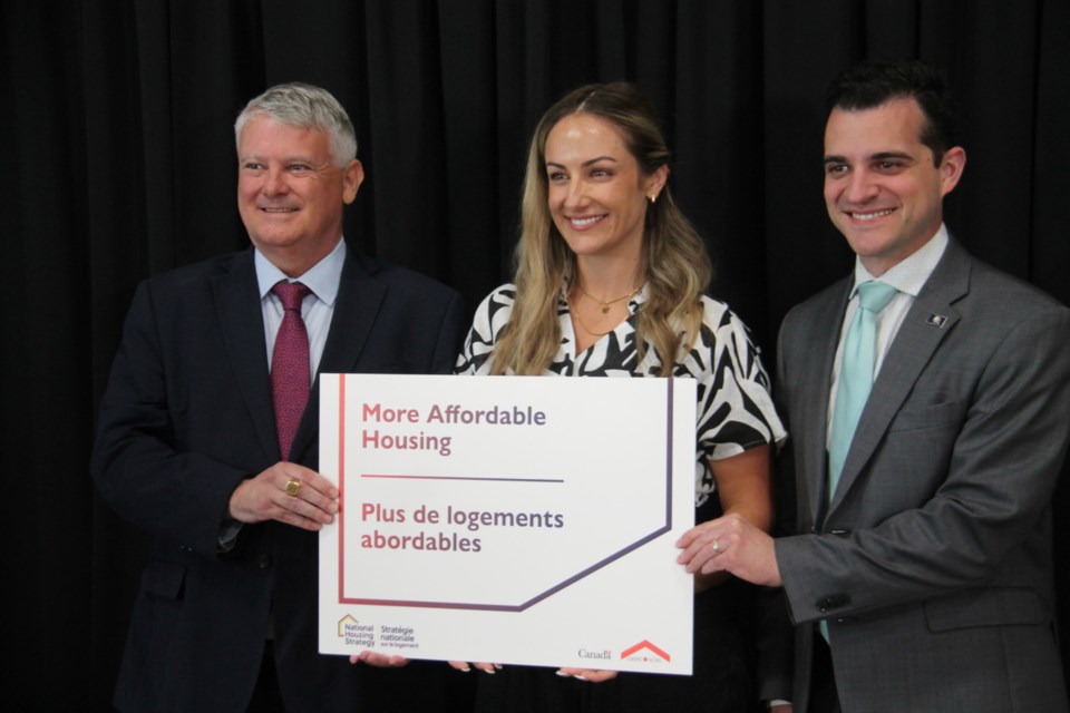 Sault MP Terry Sheehan, Stephanie Hopkin, District of Sault Ste. Marie Social Services Administration Board (DSSAB) board chair and Sault Mayor Matthew Shoemaker at a funding announcement for local housing, July 11, 2024.  