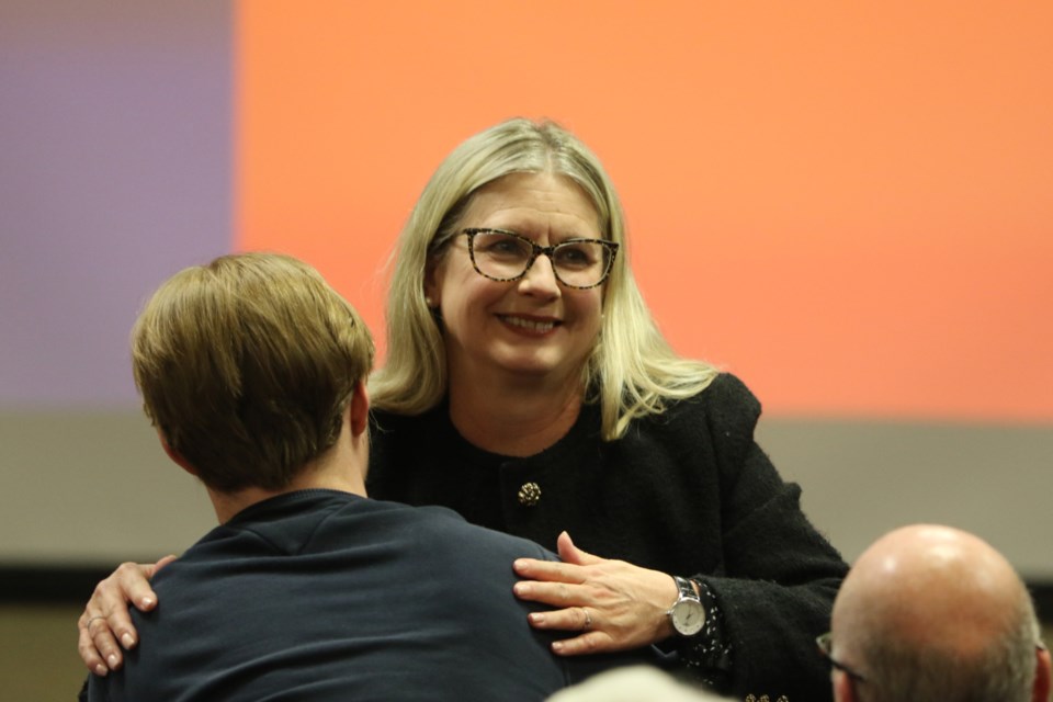 Lisa Vezeau-Allen shares an embrace after being declared the NDP candidate for the Sault Ste. Marie riding in the 2025 Ontario election.  