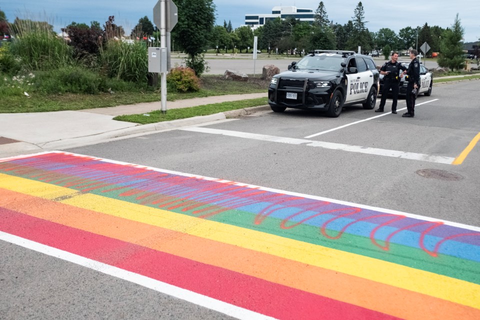 Sault Police at the scene of the Pride crosswalk on Spring Street at Bay Street. The damage comes after three days of protests against Sault Pride by a local group.