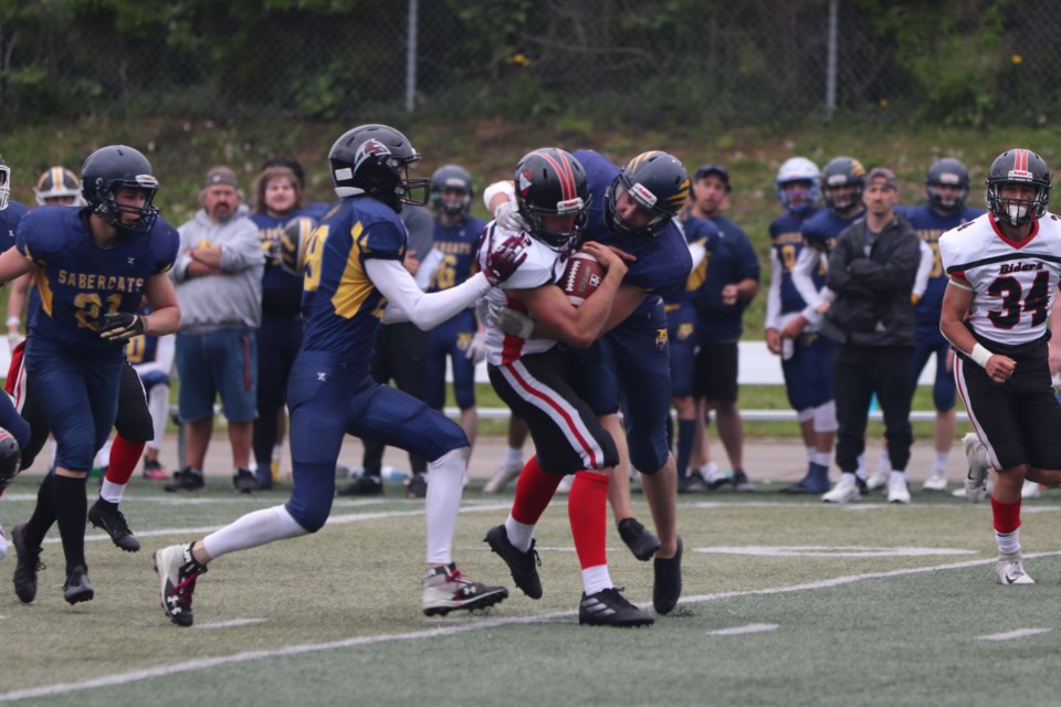 OSFL varsity action between the Sault Sabercats and Myers Riders at Superior Heights on June 11, 2022.