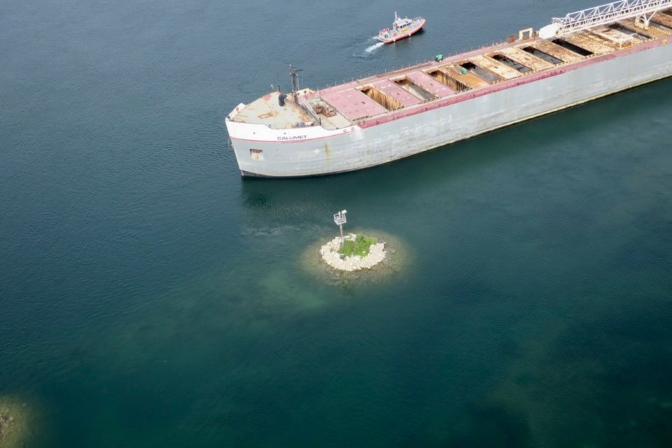 The 629-foot freighter Calumet became grounded on the north side of Sugar Island on August 9 and was moved by tugboats on August 11. On Sunday, August 13, backed up traffic had passed through and moving as normal. US Coast Guard supplied photo