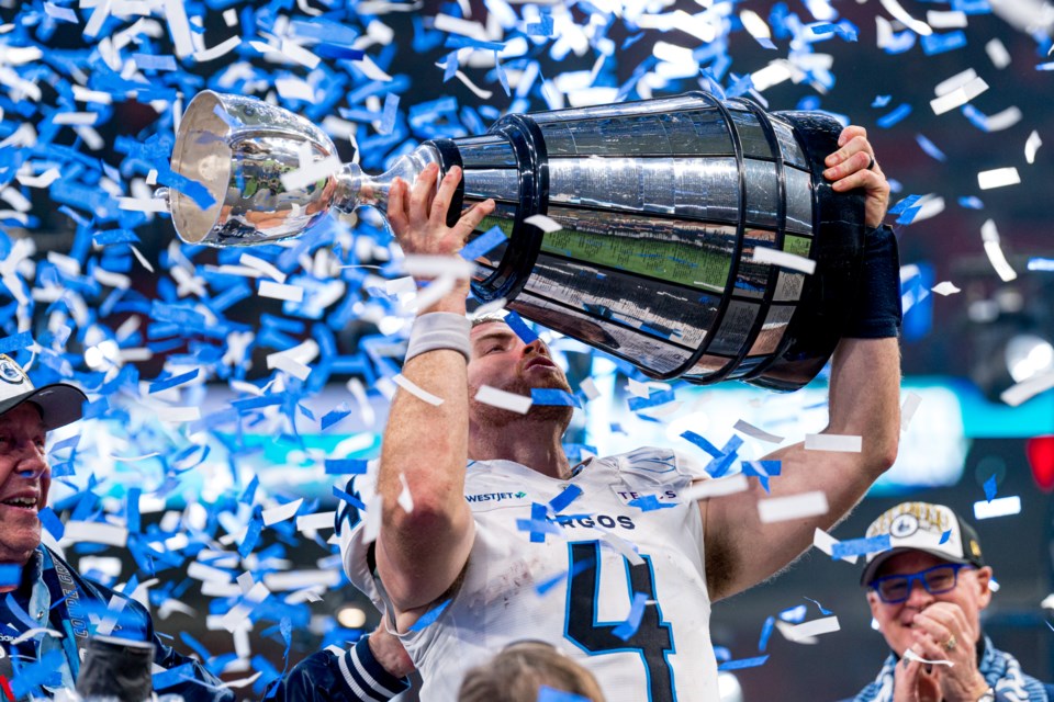 nick-arbuckle-hoists-grey-cup