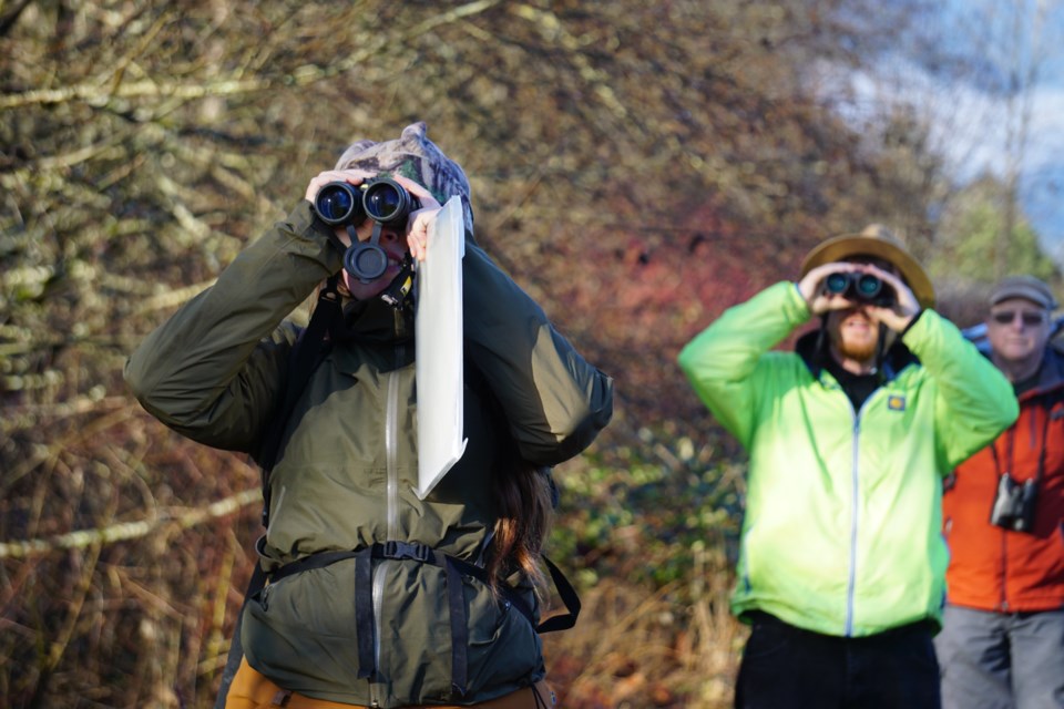 Volunteers enjoy watching eagles.                               