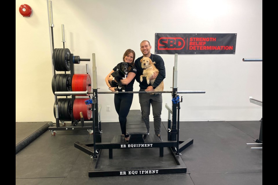 For Lisa Kitagawa, powerlifting changed her life, and now alongside her partner Lucas Paczek, she wants to show others how powerful (and fun) strength training can be.
Their dogs are Tater Tot (blonde) and Spud.