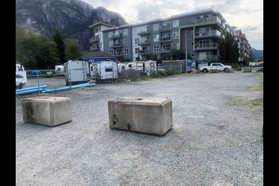 Large cement blocks were recently placed around the now mostly empty Loggers Lane lots.