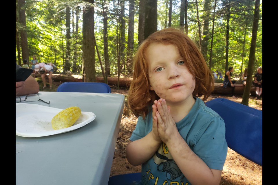 Three year old Colton appreciates the corn at the Brackendale Fall Fair on Saturday, Sept. 9.