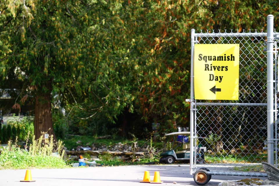 A warm welcome to Rivers Day—A bright yellow sign invites attendees to the Rivers Day celebration hosted by the Squamish River Watershed Society.               