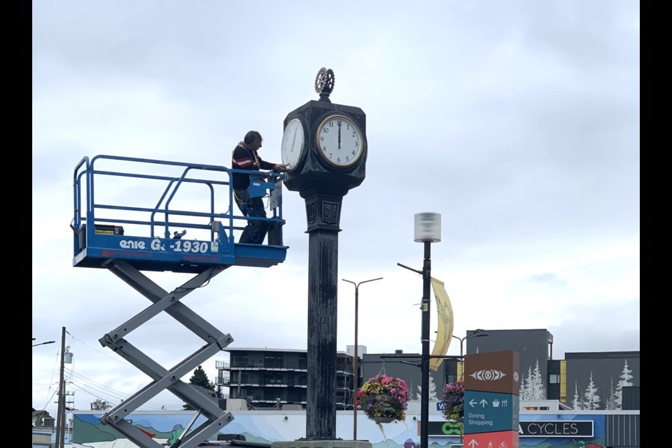 Fixing the downtown clock on Monday morning. 