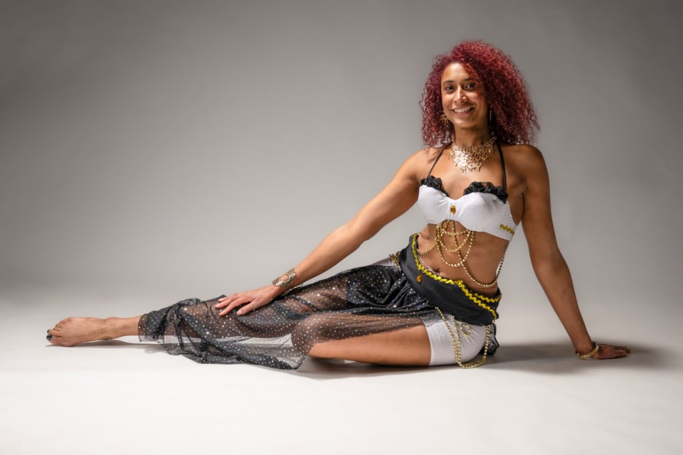 Rose Laure Agbazan, whose stage name is Kadisha, in belly dance wear she made herself. 