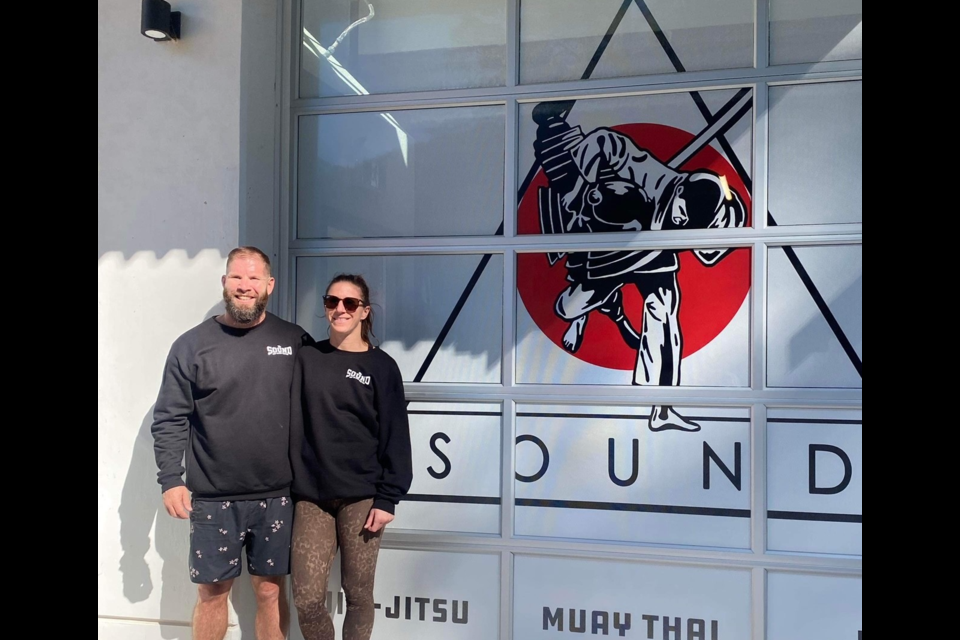 Jamey-Lyn Horth Wessels and her husband Kasey Smith at the new location of The Sound Martial Arts. 