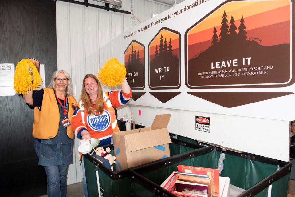 FREE STUFF — Volunteer Linda Frey (left) and Strathcona County waste diversion outreach programs supervisor Erin Wildeboer show off some of the many items that can be found at the Sherwood Park HodgePodge Lodge. St. Albert council voted May 7, 2024 to add a similar take-it-or-leave-it facility to the city’s 10-year capital plan. KEVIN MA/St. Albert Gazette